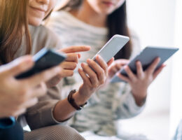 Group of people using and looking at mobile phone and tablet pc