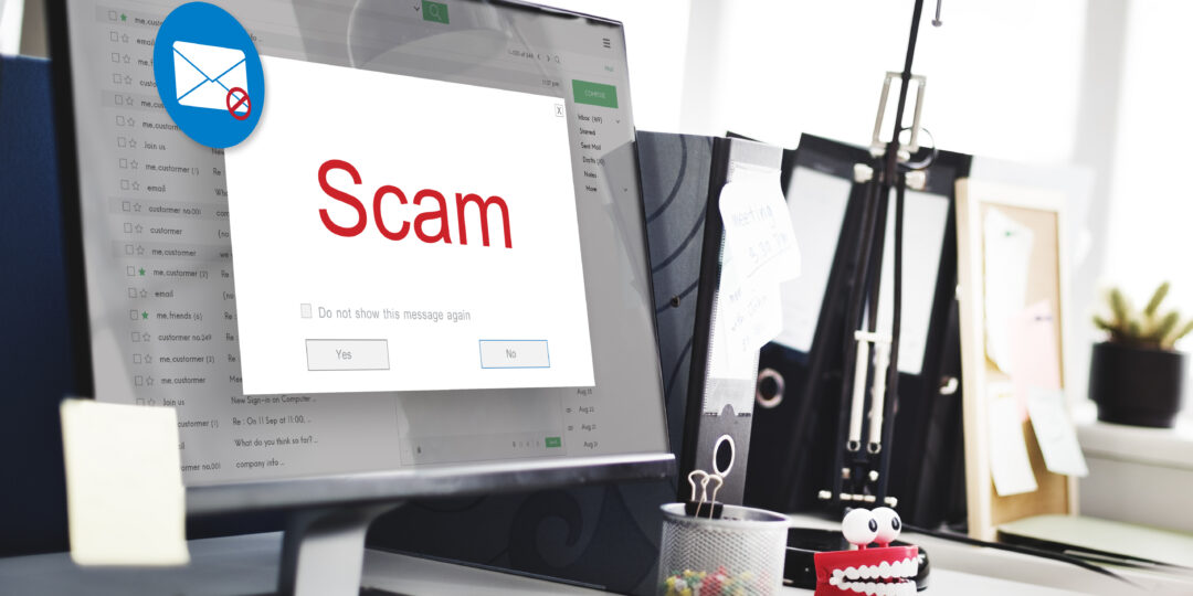 Auf einem Computer-Bildschirm erscheint eine Scam-Warnung.